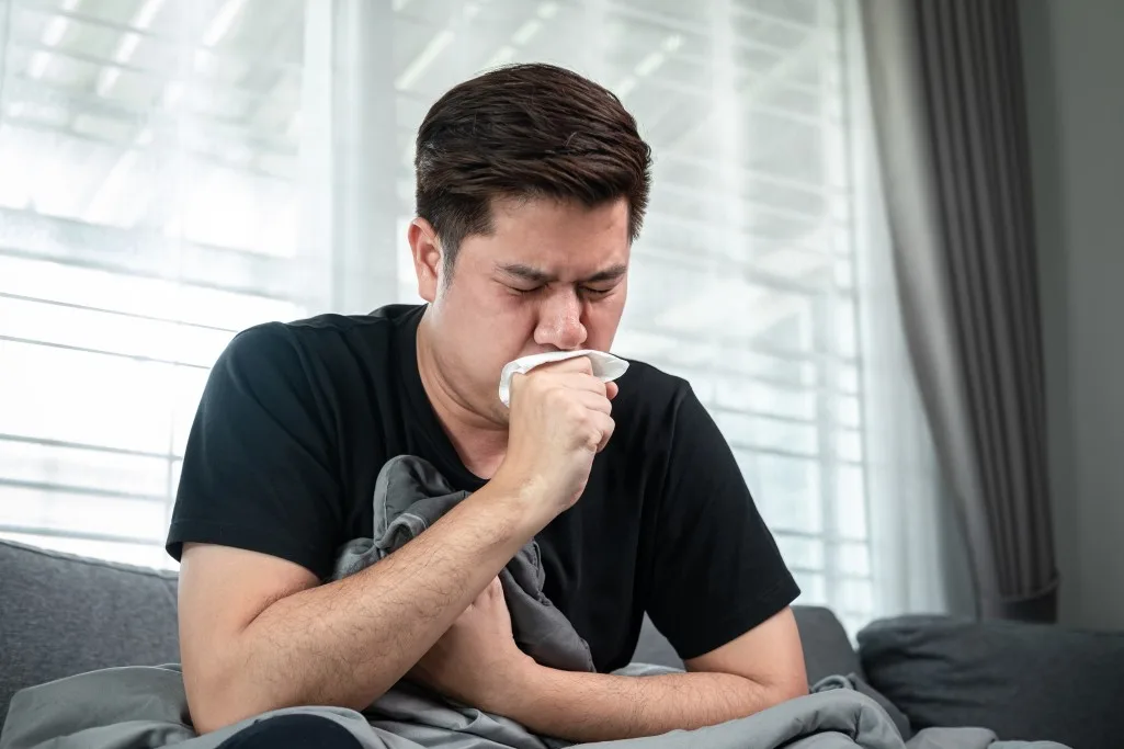 man-using-tissue-in-hand-cover-your-mouth-when-cough-and-sneezing-while-feeling-sick