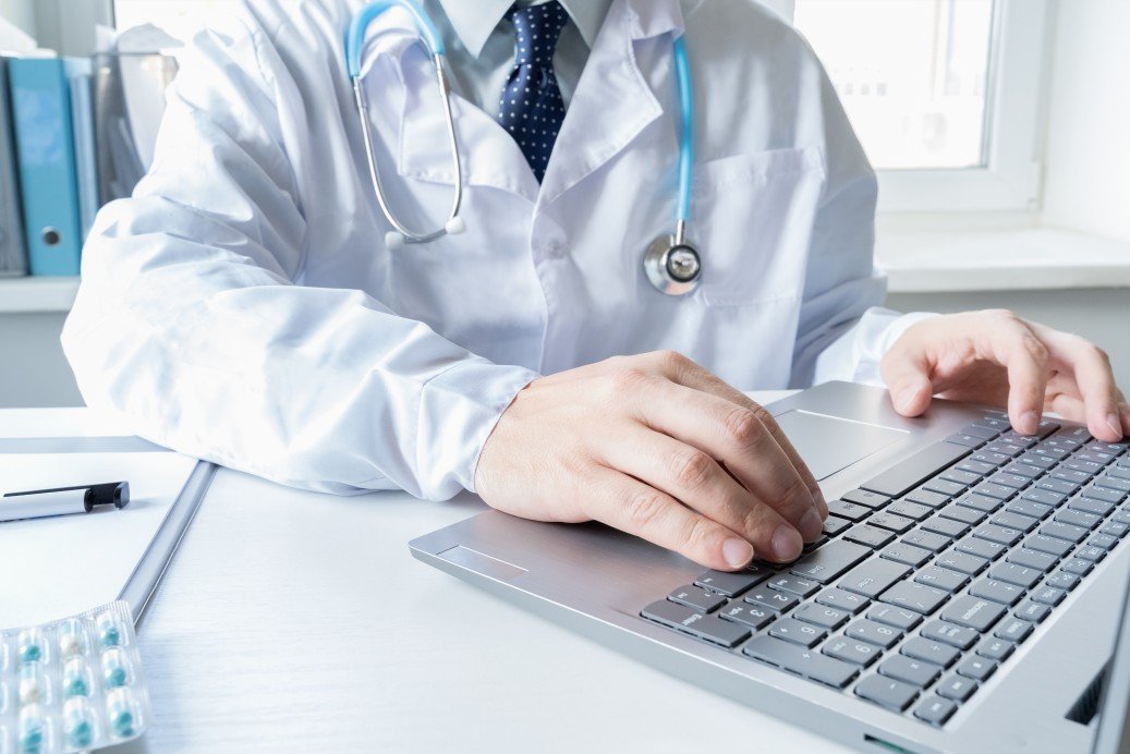 doctor-types-speaks-talks-to-patient-by-laptop-telehealth-telemedicine