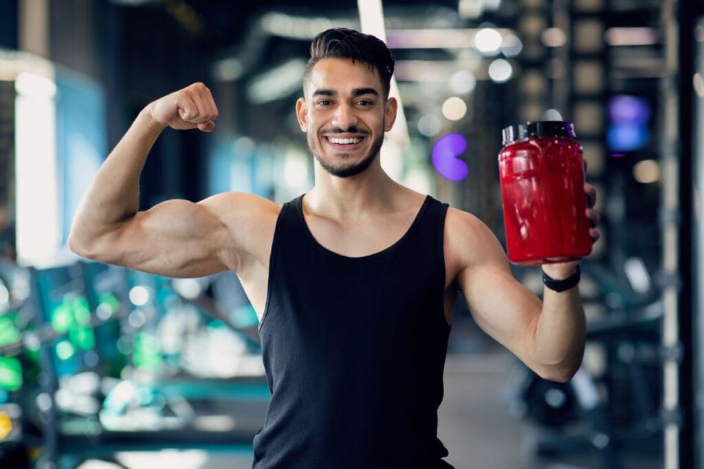 fitness-supplements-musculate-arab-man-holding